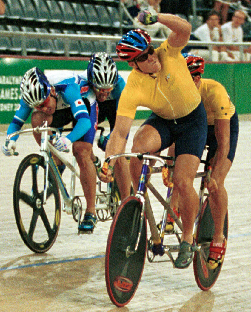 Darren Harry and Paul Clohessy celebrate tandem sprint gold.