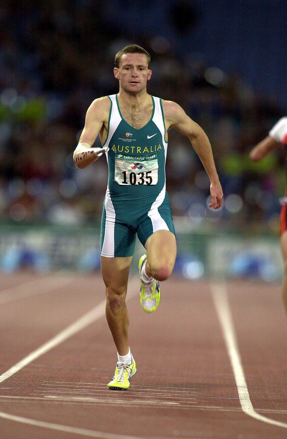 Heath Francis at the Sydney 2000 Paralympics: Men's 400m T46 final; gold; race action