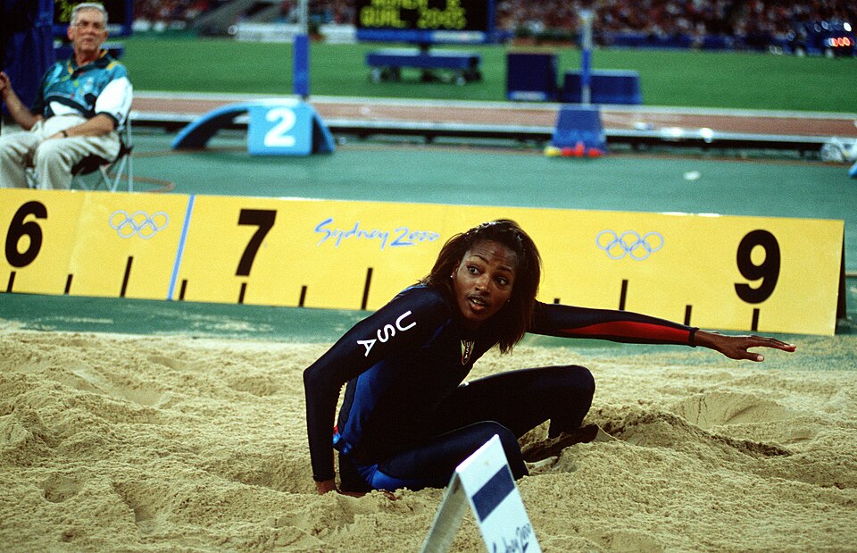 Dawn Burrell lands in the sandpit during the Sydney Olympic long jump competition.