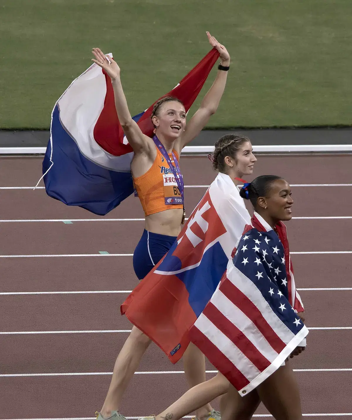 Femke Bol, Emma Zapletalová and Jasmine Jones after the women's 400 metres hurdles final at Tokyo 2025.
